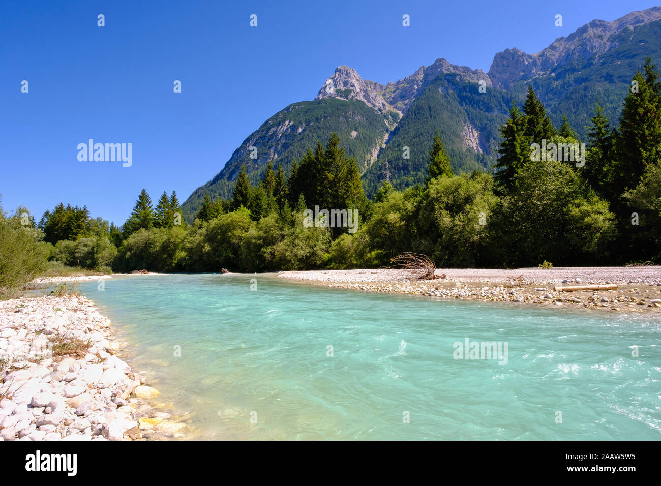 Scenic view of Isar River with Karwendel mountains in background against clear blue sky, Tyrol, Austria Stock Photo