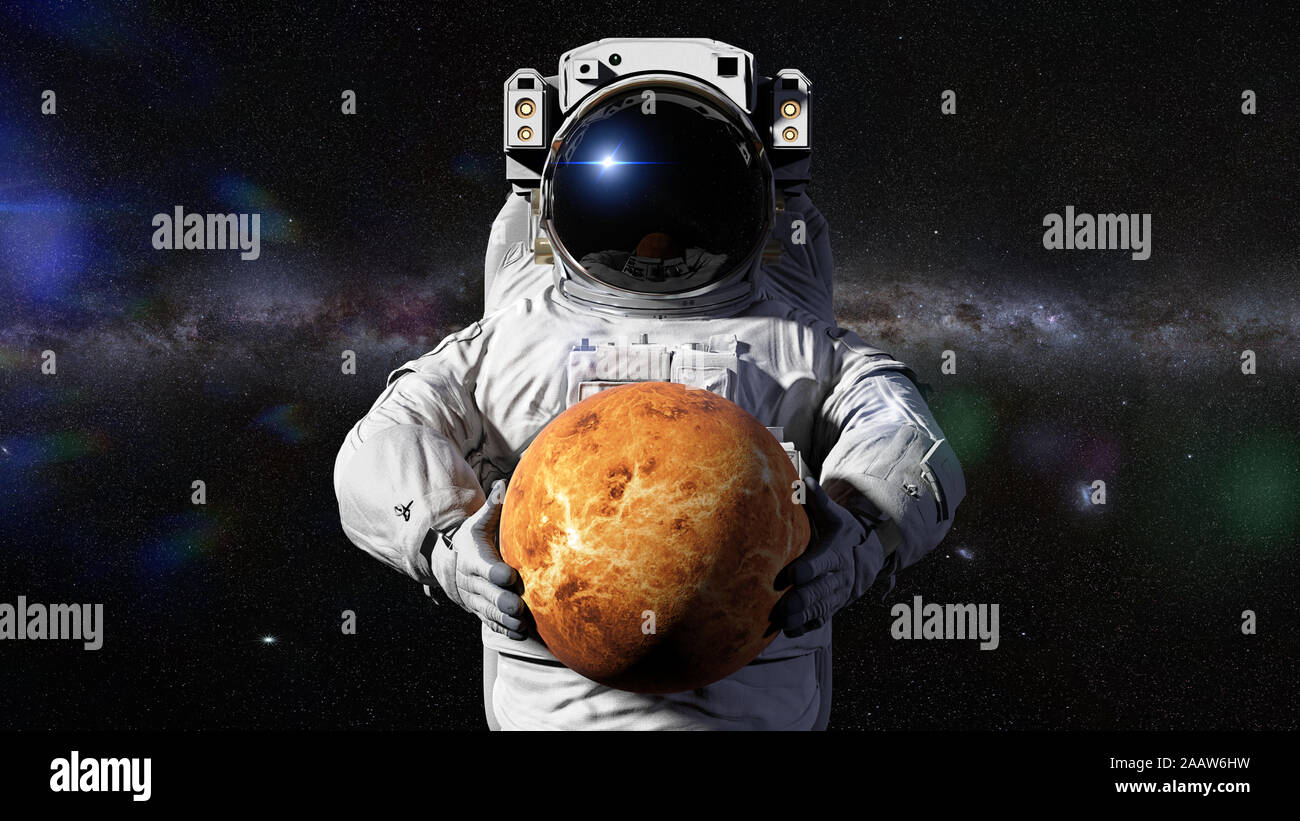 astronaut holding planet Venus, world of the solar system Stock Photo -  Alamy