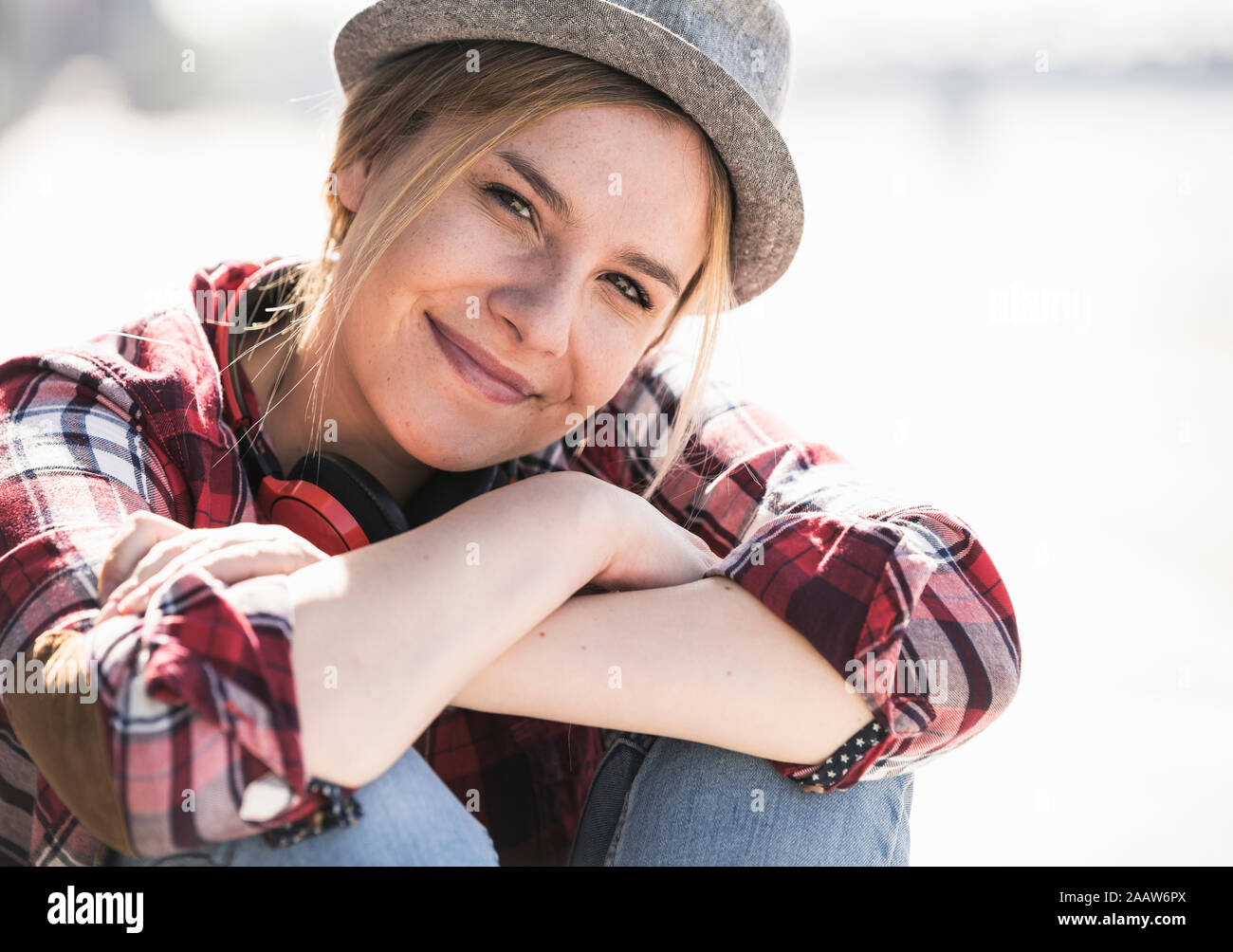 Portrait of young smiling woman with hat Stock Photo