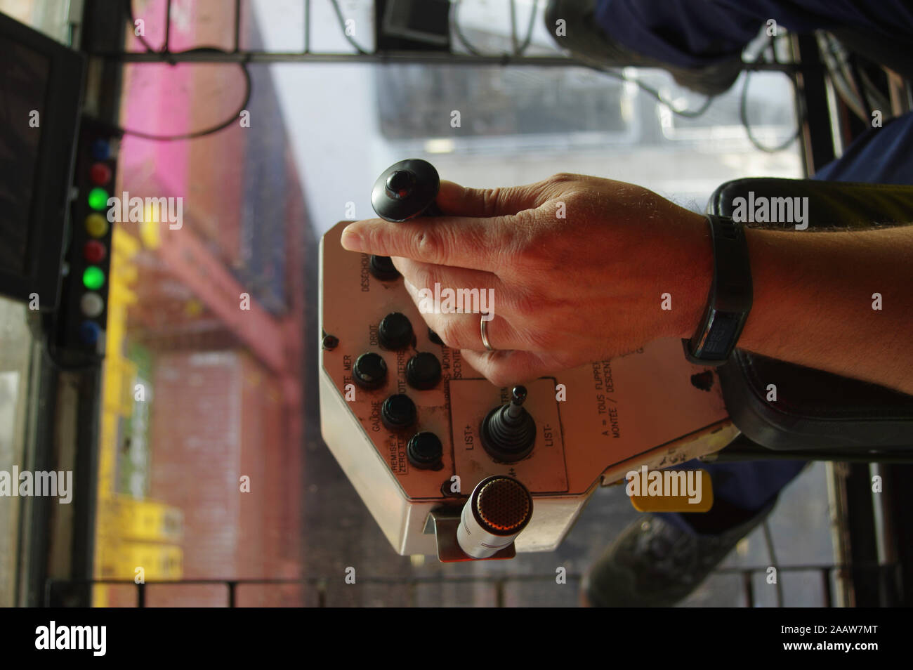 Gantry crane operator moving a sea container in the Port Stock Photo ...