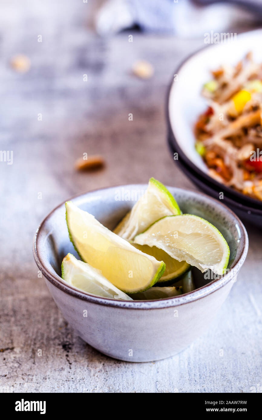 Lime pieces in bowl Stock Photo