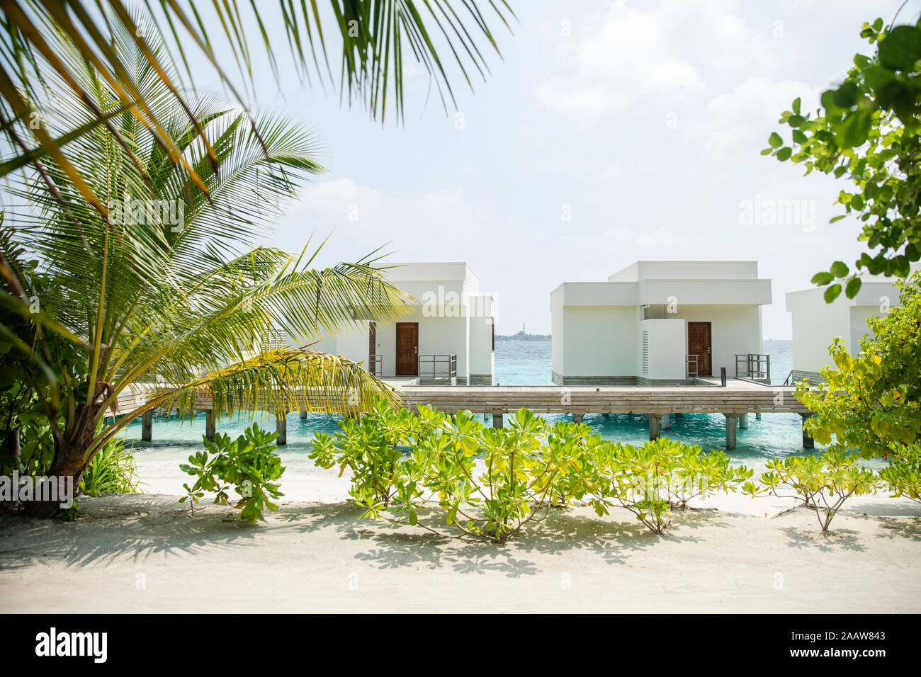 View of villas over sea against sky at Maldives Stock Photo