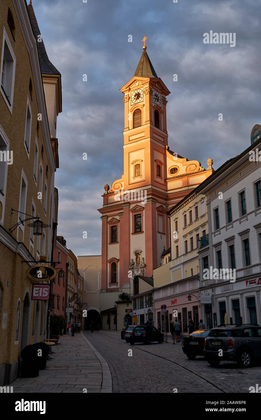 Low angle view of St. Paul Church against cloudy sky in Passau at sunset, Bavaria, Germany Stock Photo