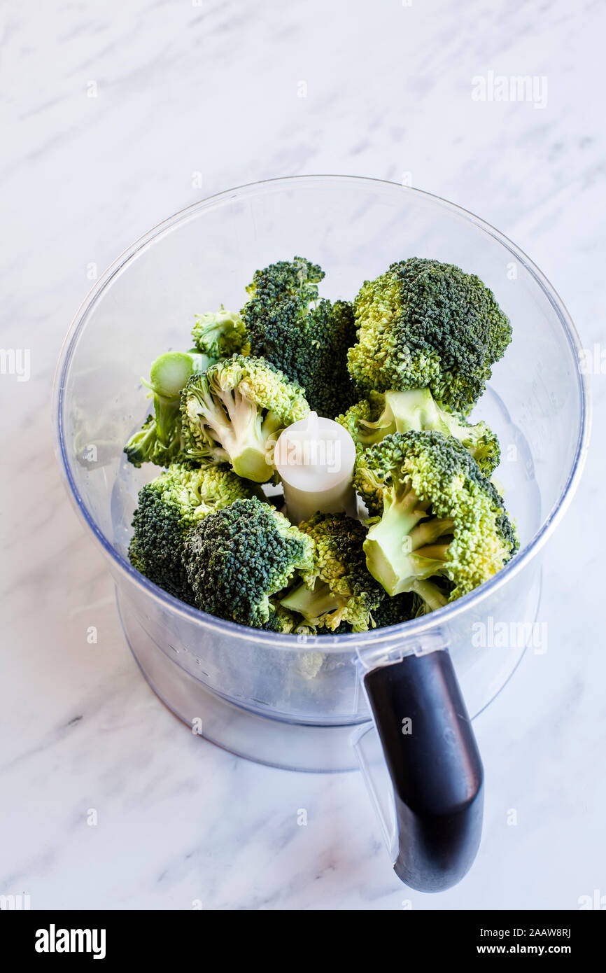 Broccoli in food processor Stock Photo