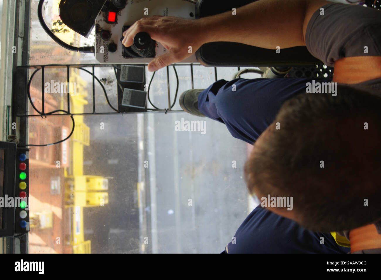 Gantry crane operator moving a sea container in the Port Stock Photo ...
