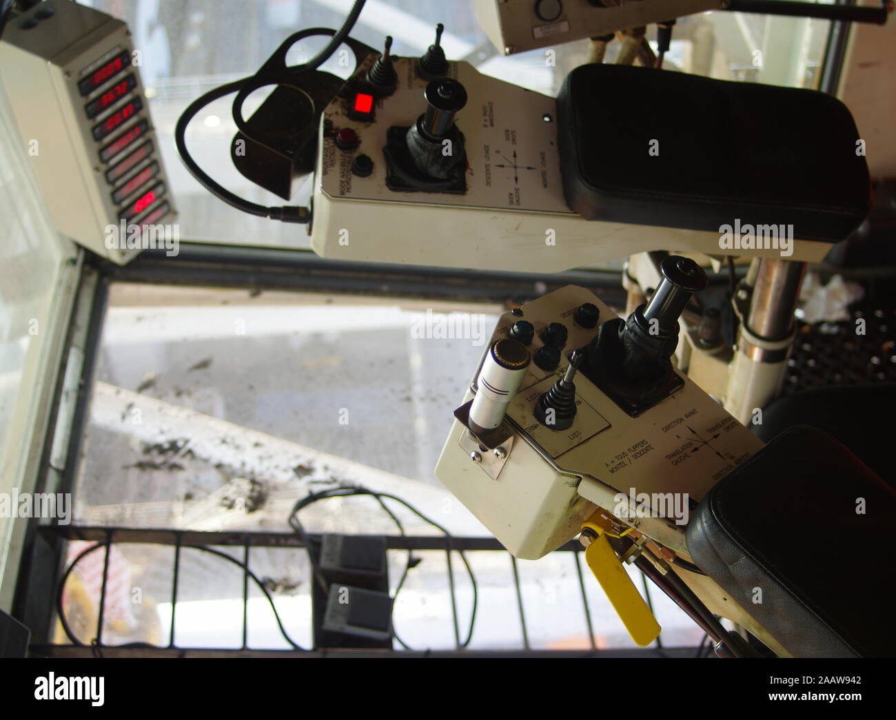 Gantry crane operator moving a sea container in the Port Stock Photo