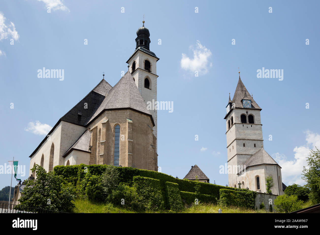 Low angle view of Pfarrkirche Sankt Andreas and Liebfrauenkirche Kitzbühel against sky, Tyrol, Austria Stock Photo