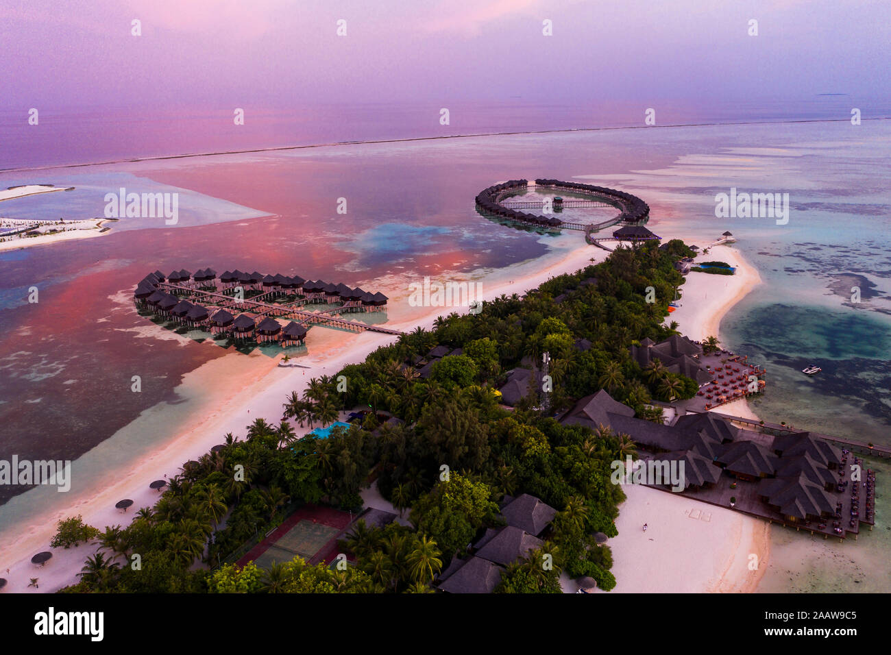 Aerial view of stilt houses at Olhuveli island during sunrise, Maldives Stock Photo