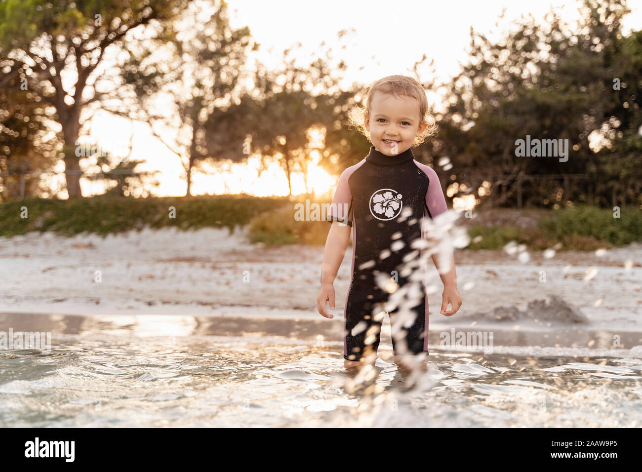 Portrait of cute toddler girl standing in the sea Stock Photo