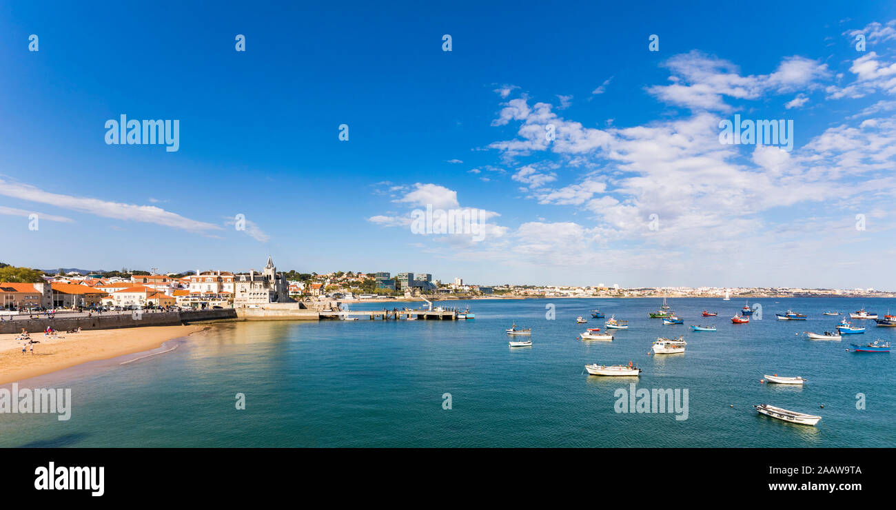 Fishing boats in sea against sky at Cascais, Lisbon, Portugal Stock Photo
