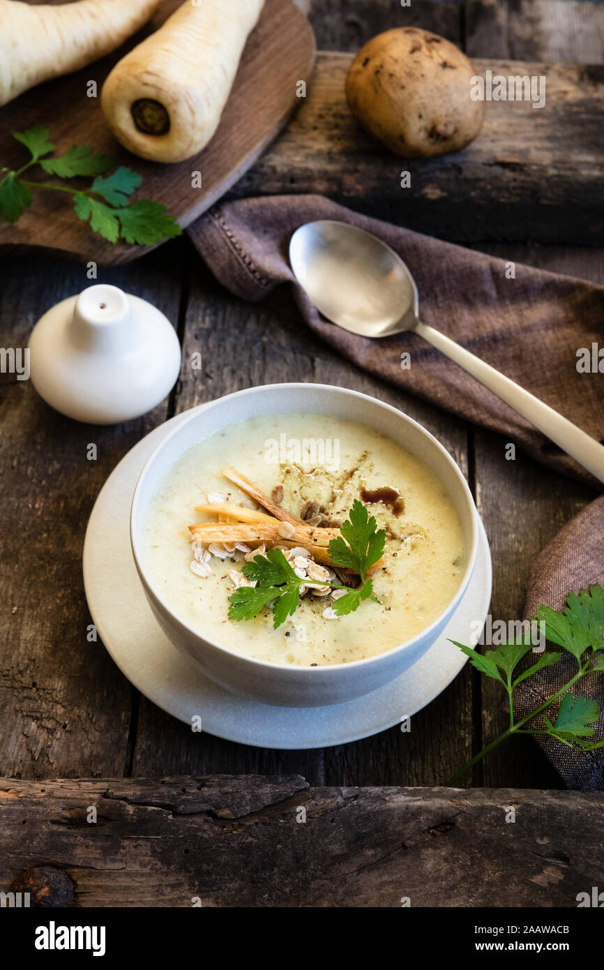 High angle view of oats soup with ingredients on wooden table Stock Photo