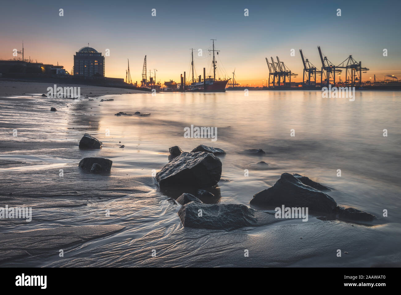 View of harbor against sky during sunset at Hamburg, Germany Stock Photo