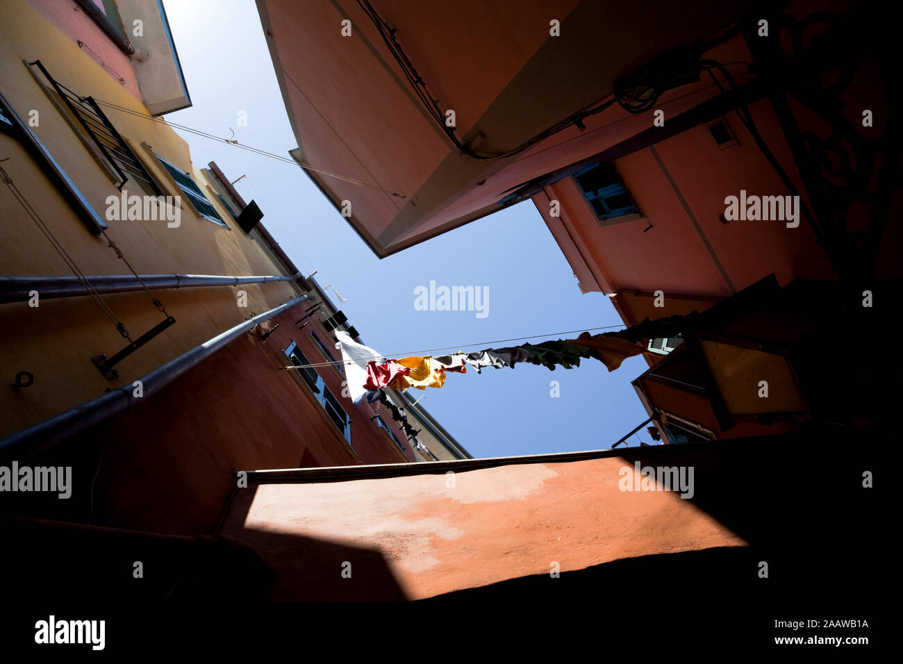 Worm's eye view of laundry hanging out to dry in Manarola, Cinque Terre, Italy Stock Photo