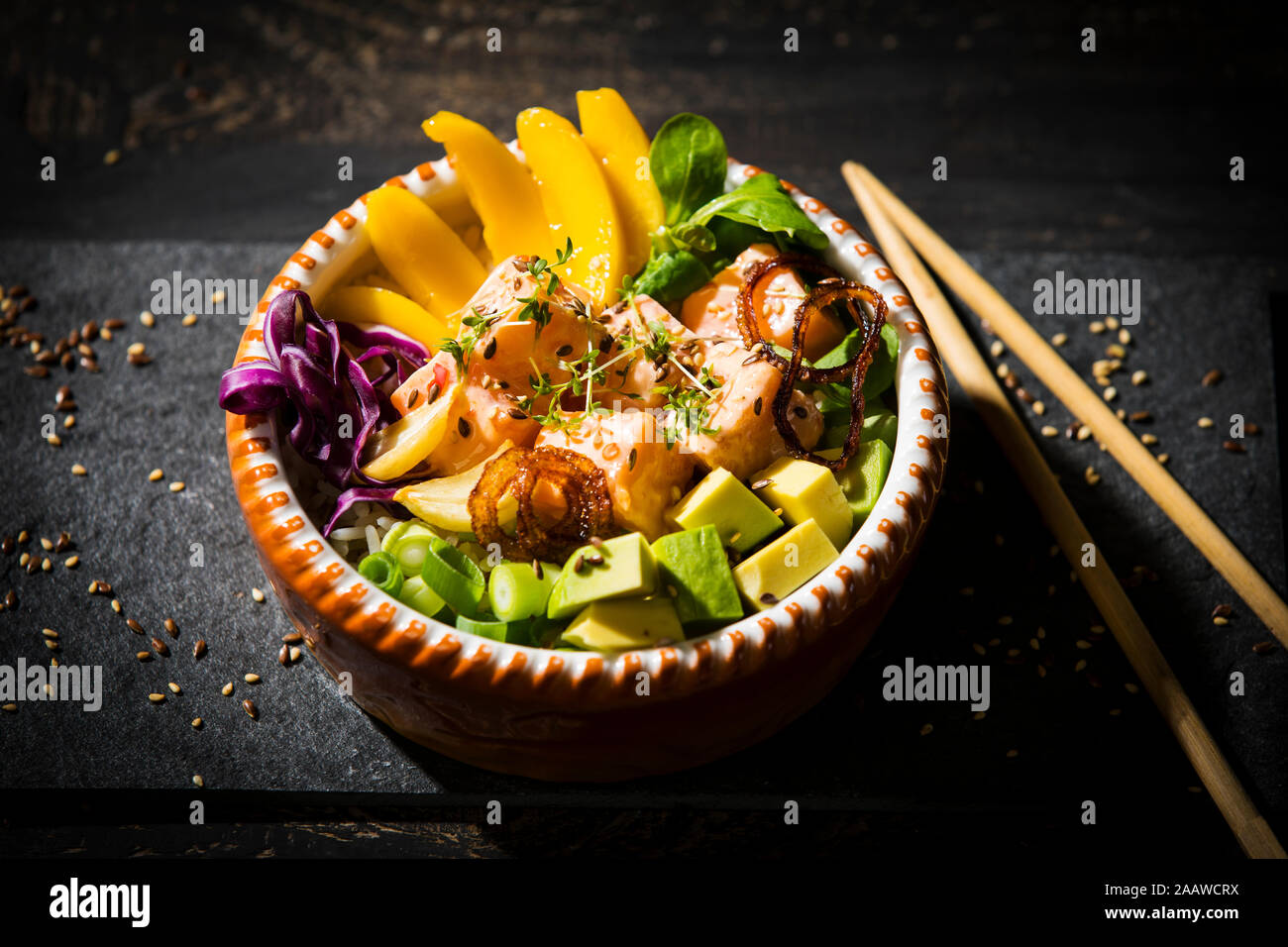Close-up of poke bowl with chopsticks in studio Stock Photo