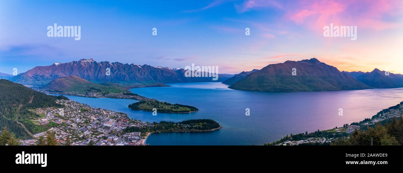Panoramic shot of Lake Wakatipu against sky during sunset at Queenstown, South Island, New Zealand Stock Photo