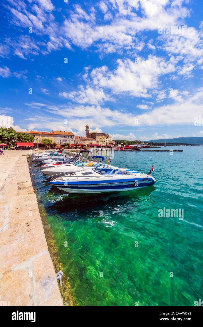 Speedboats moored in Adriatic sea against sky at Krk, Croatia Stock Photo
