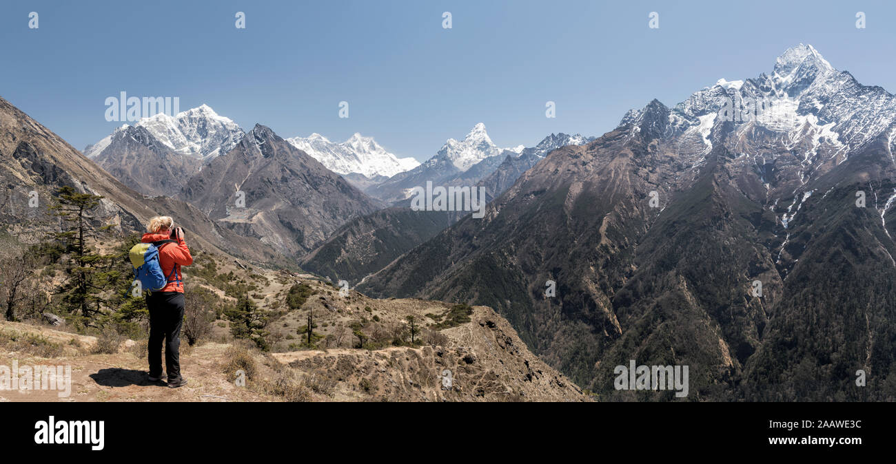 Woman hiking the Everest Base Camp trek, Himalayas, Solo Khumbu, Nepal Stock Photo