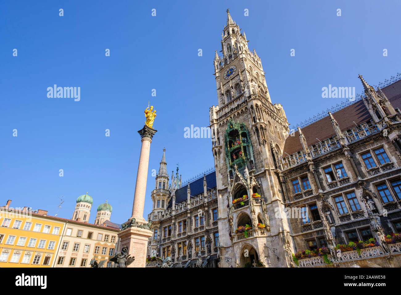 Germany, Bavaria, Upper Bavaria, Munich, New Town Hall, domes of Frauenkirche and Mariensaule column on Marienplatz Stock Photo