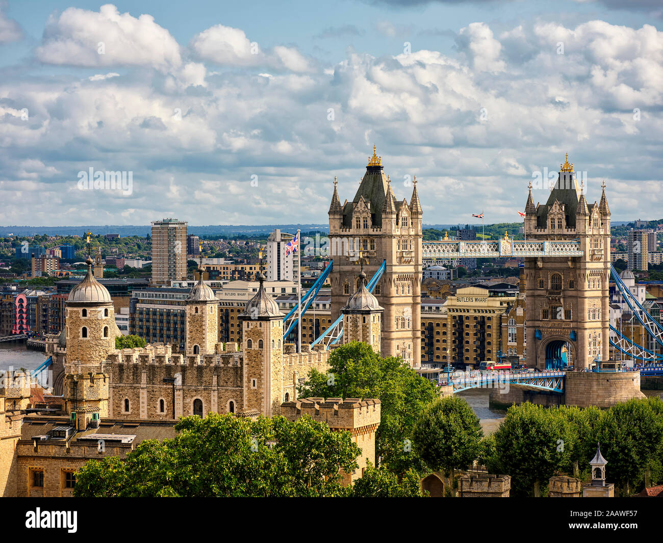 High angle view of Tower Bridge with cityscape in background against cloudy sky at London Stock Photo