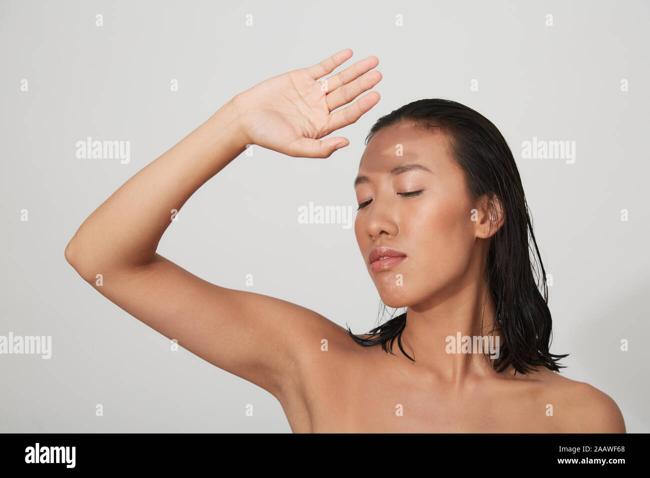 Portrait of young female Chinese woman with closed eyes Stock Photo