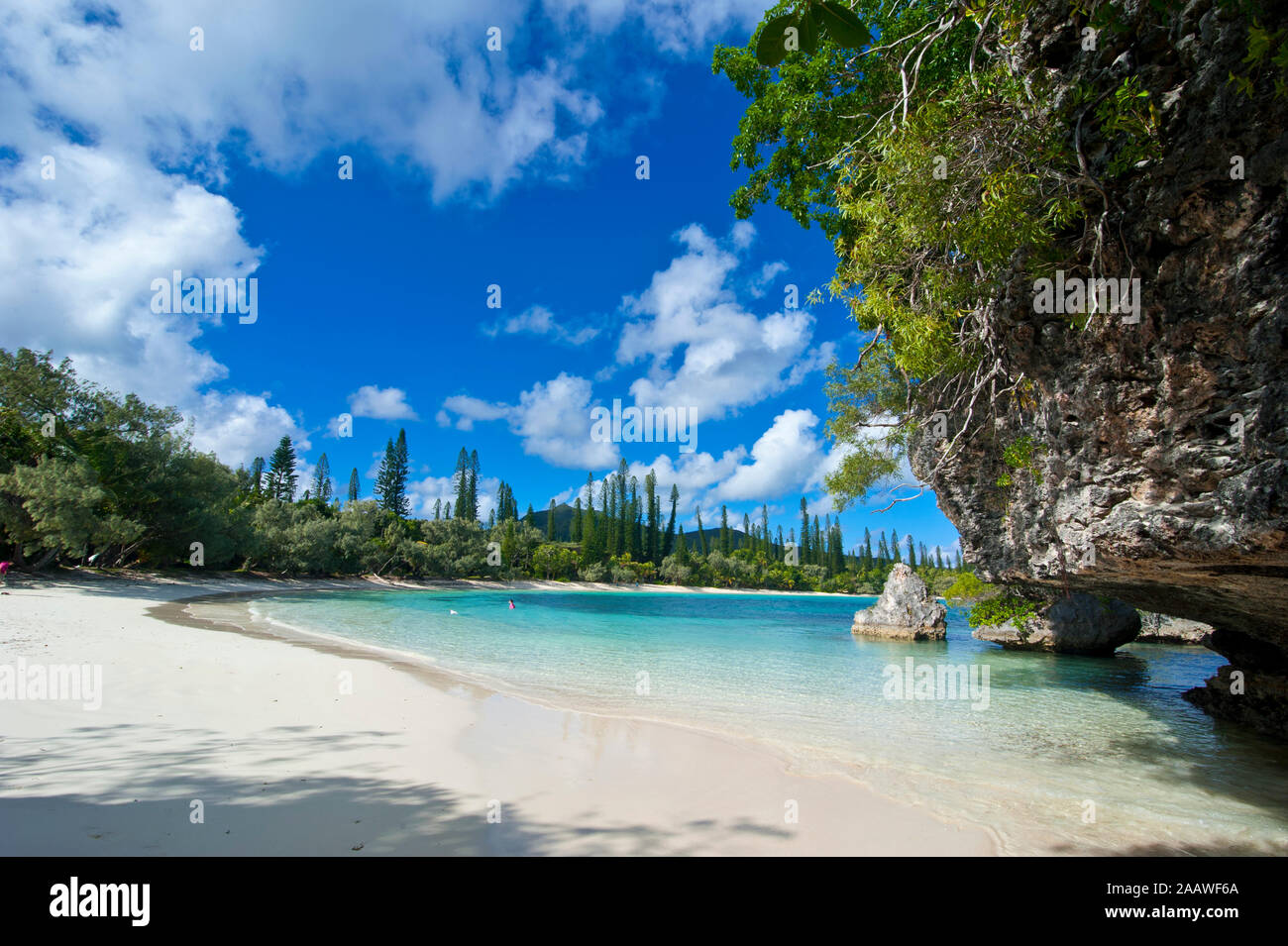 Scenic view of white sand beach against sky, Ile Des Pins, New Caledonia Stock Photo