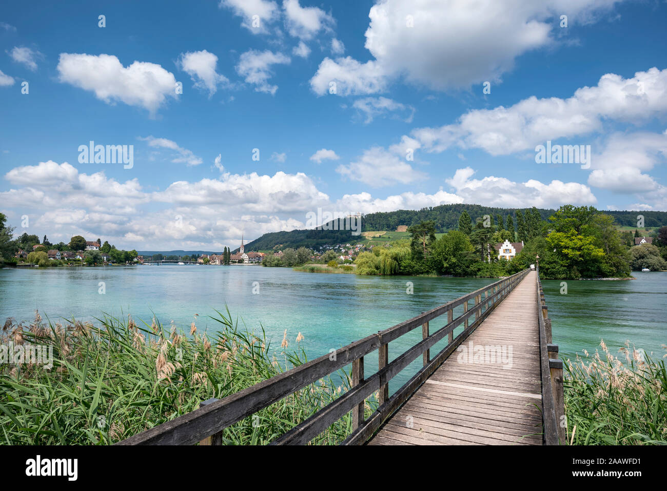 Diminishing perspective of footbridge over Rhine river at Werd Island, Switzerland Stock Photo