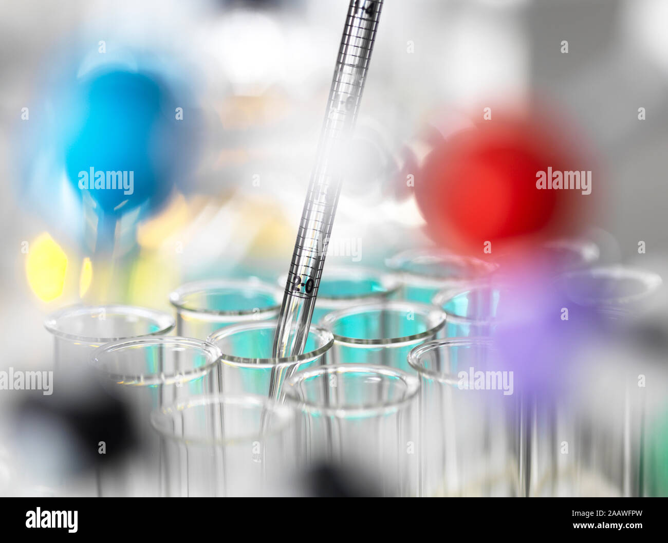 Chemical samples pipetting in test tubes for experiment at laboratory Stock Photo