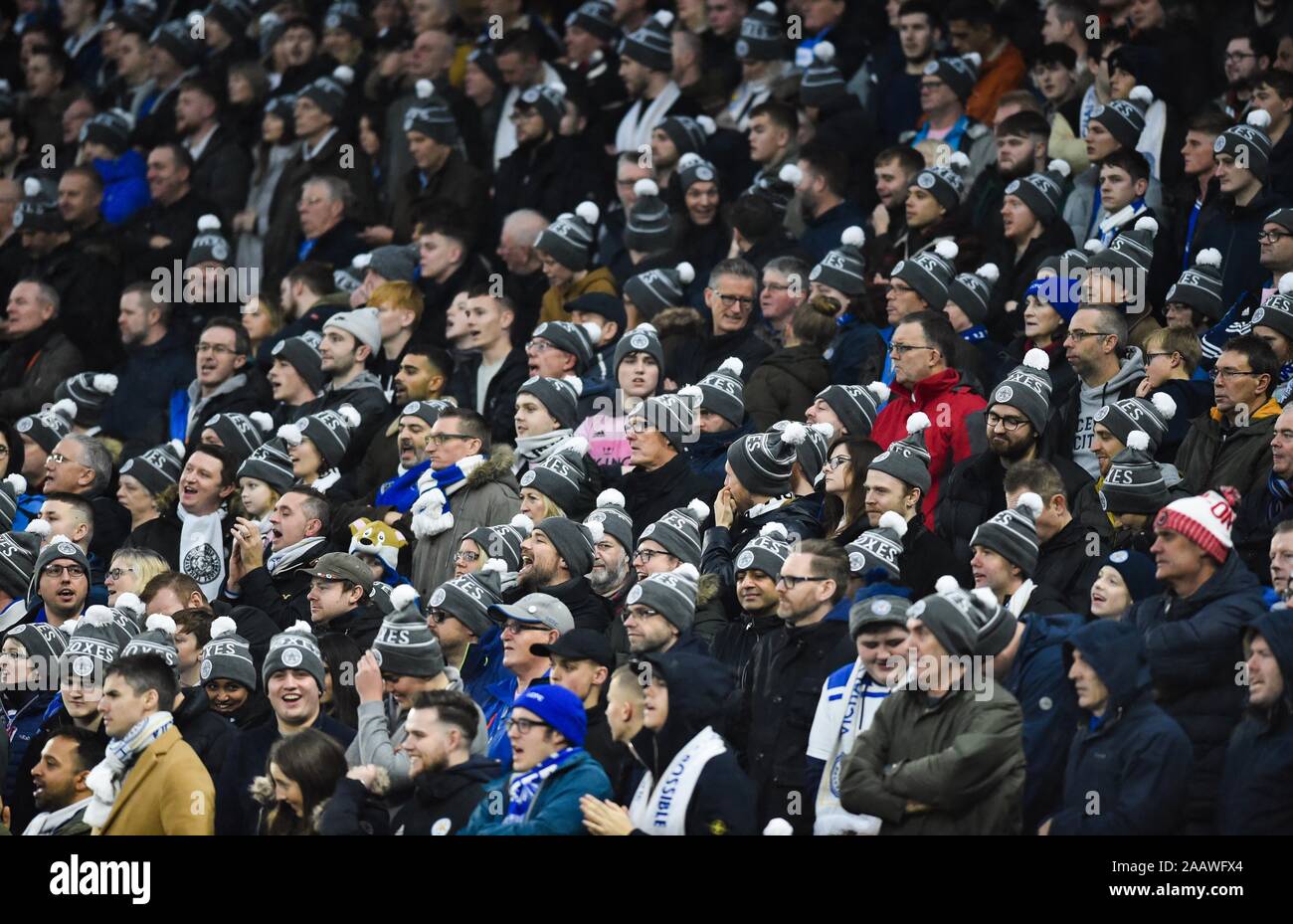 Leicester fans wearing hats given to them during the Premier League match between Brighton and Hove Albion and Leicester City at the American Express Community Stadium , Brighton , 23 November 2019 -  Editorial use only. No merchandising. For Football images FA and Premier League restrictions apply inc. no internet/mobile usage without FAPL license - for details contact Football Dataco  : Stock Photo