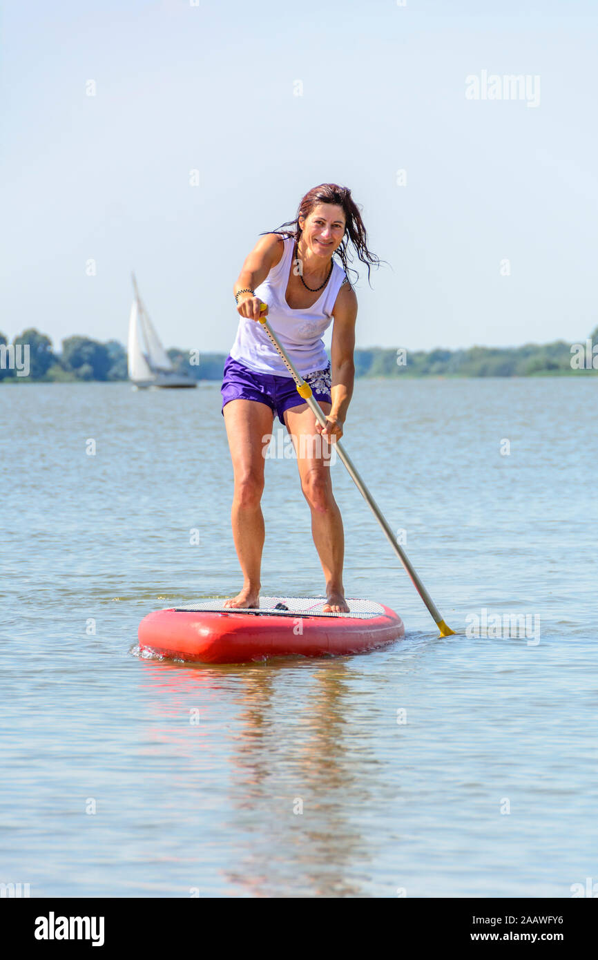 Woman paddling board hi-res stock photography and images - Alamy