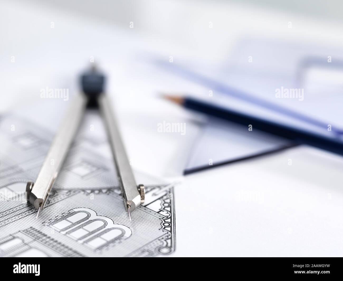 Close-up of drawing equipment on house blueprint in office Stock Photo