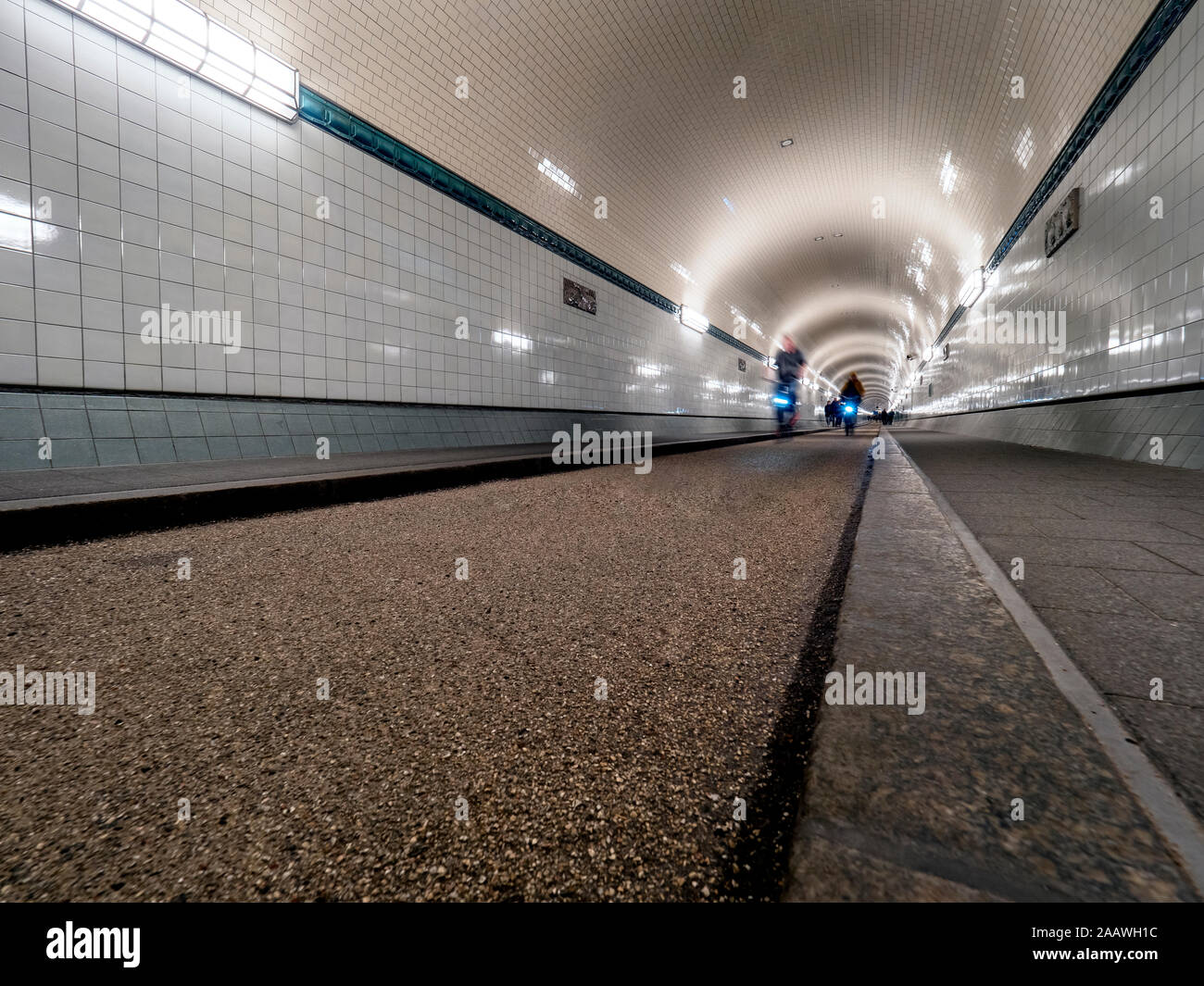 Old Elbe Tunnel with cyclists, Hamburg, Germany Stock Photo