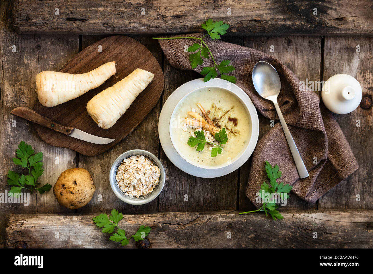 Directly above shot of oats soup served with ingredients on wooden table Stock Photo