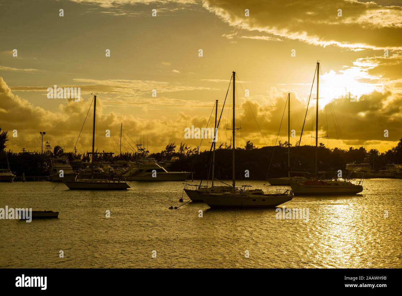 Sailboats moored at harbor of Ponce at sunset, Puerto Rico, Caribbean Stock Photo