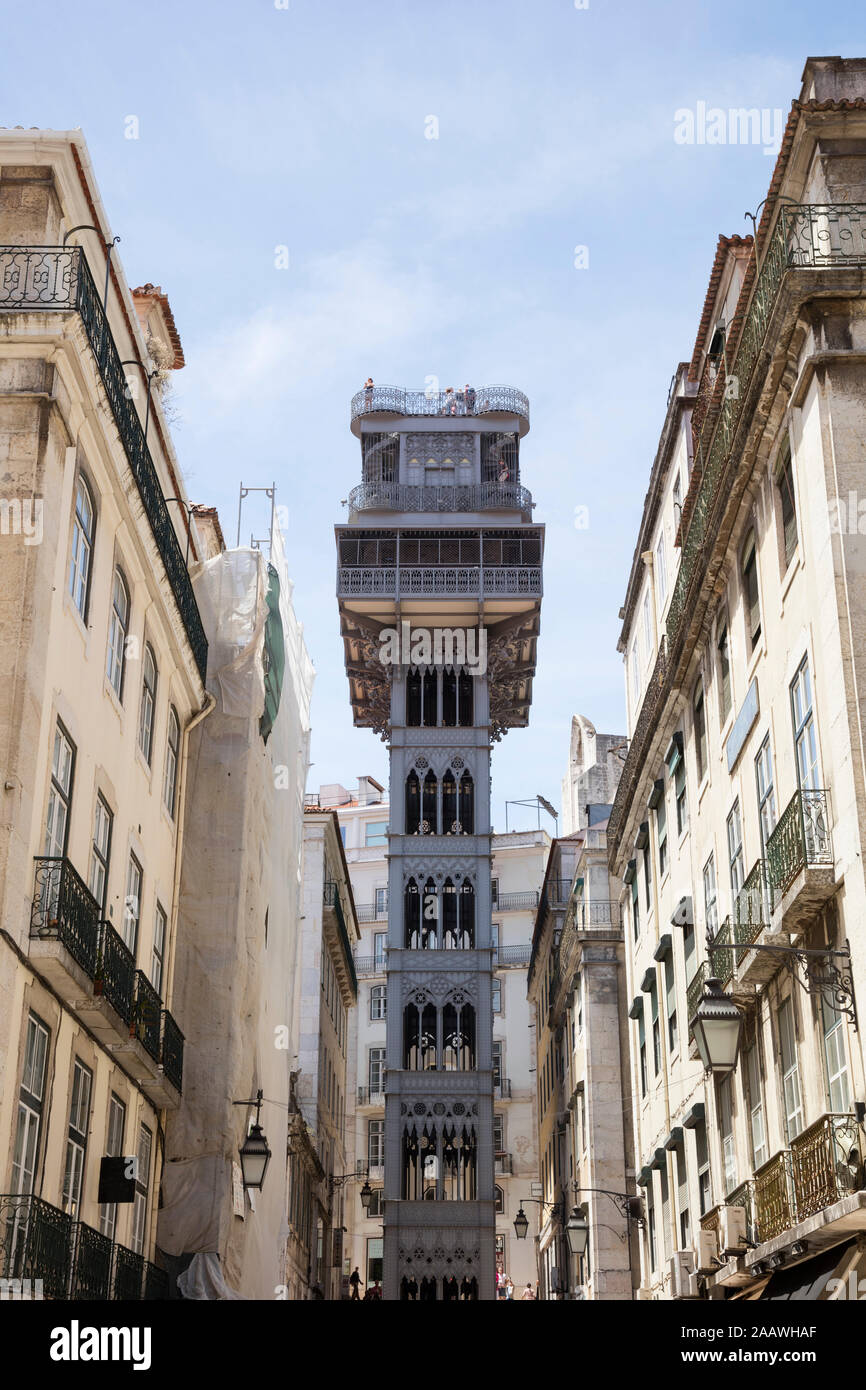 Low angle view of Santa Justa Elevator and buildings against sky, Lisbon, Portugal Stock Photo