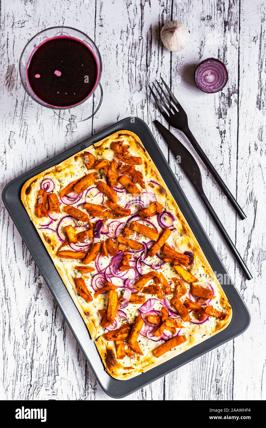 Tart with cheese, garlic, red onions, gyros strips and sauerkraut cabbage Stock Photo