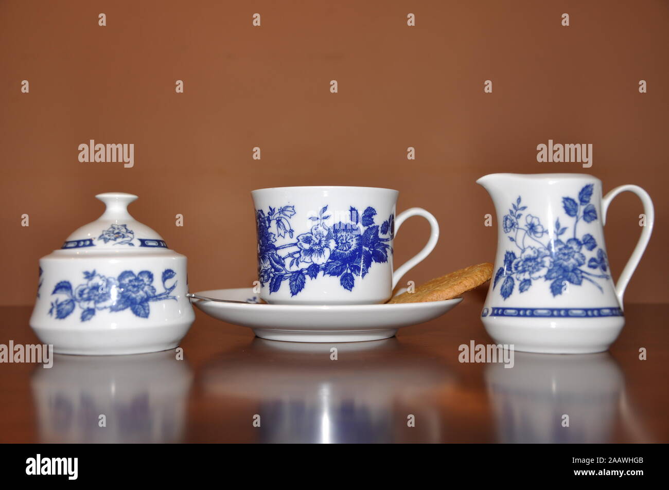 Elegant porcelain coffee cup and saucers on wooden brown table Stock Photo