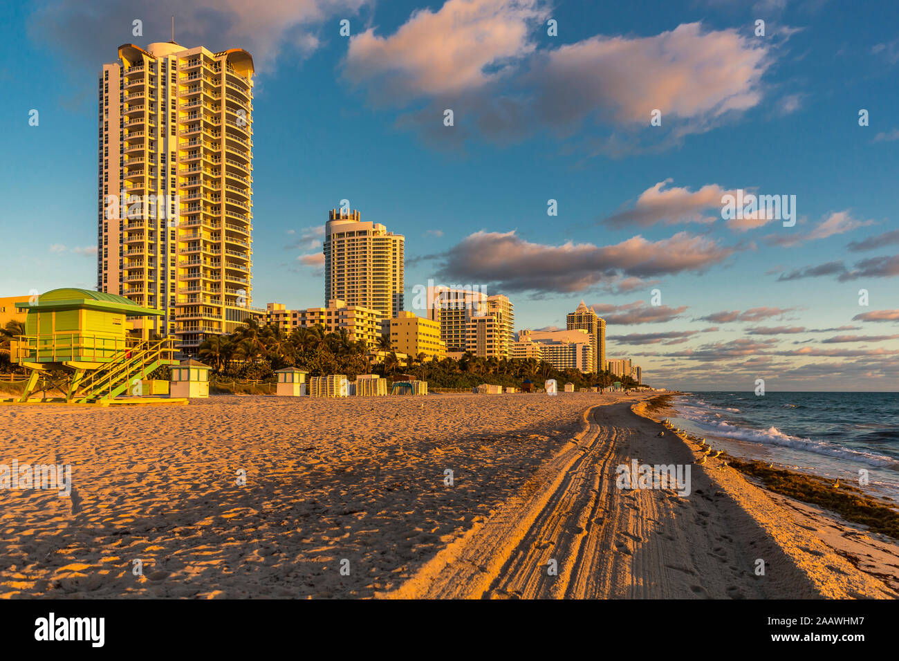 Skyscraper by Miami beach against sky during sunrise in Florida, USA Stock Photo