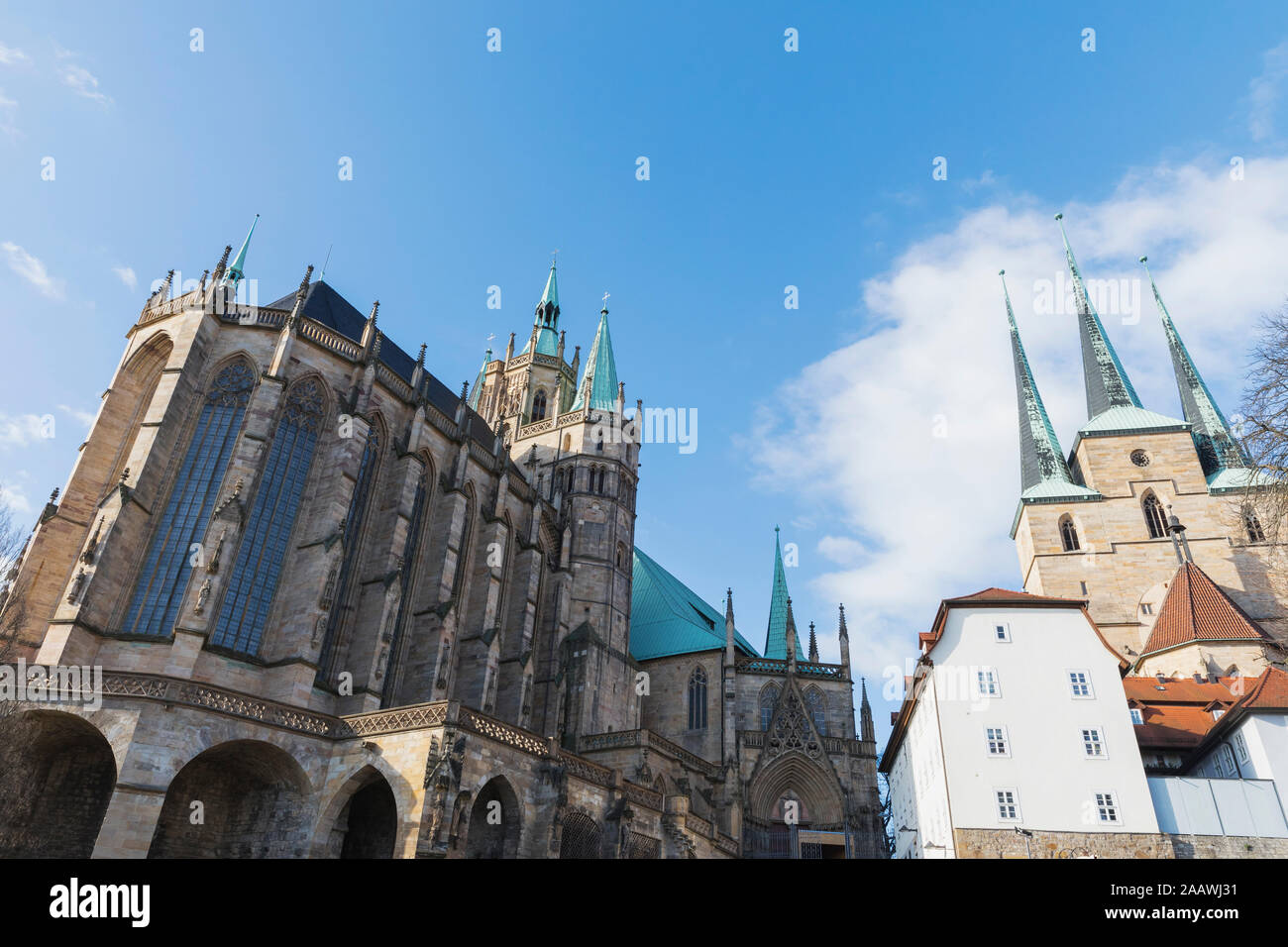 Low angle view of churches against blue sky in Erfurt, Germany Stock Photo