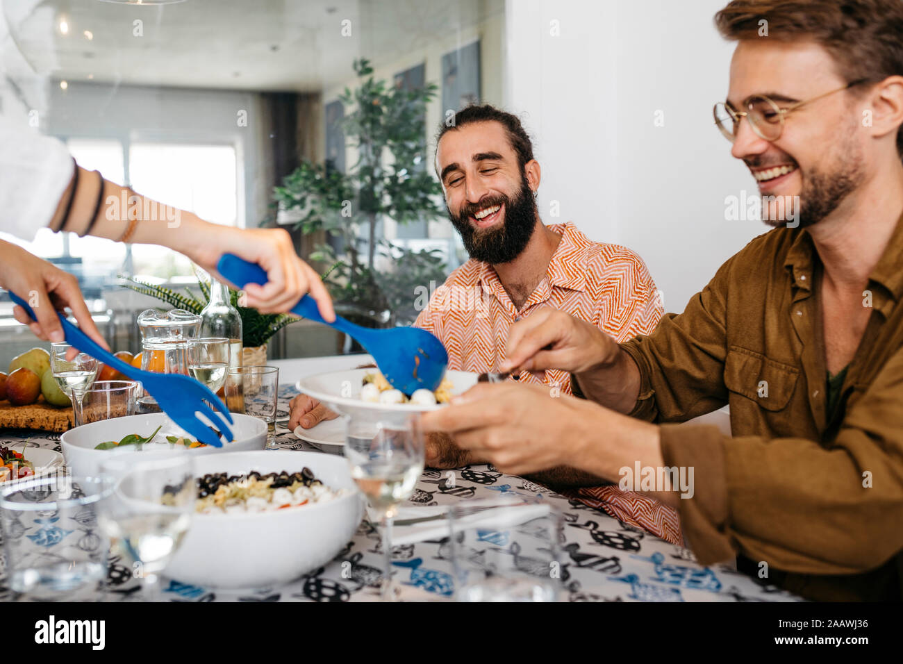 Happy friends having healthy lunch together Stock Photo