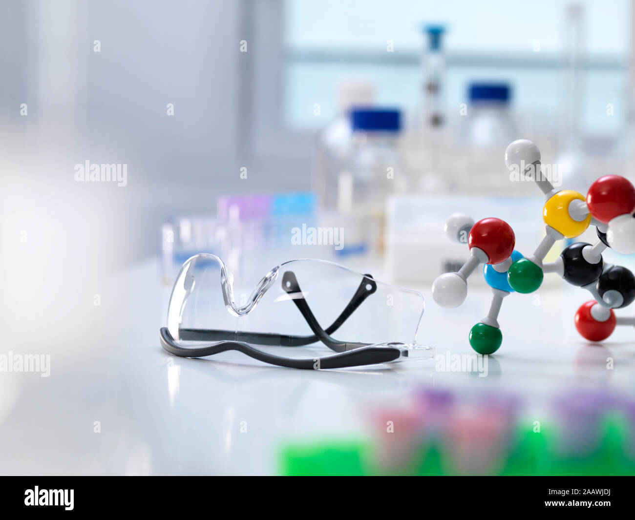 Close-up of molecular structure with protective eyewear on table in laboratory Stock Photo
