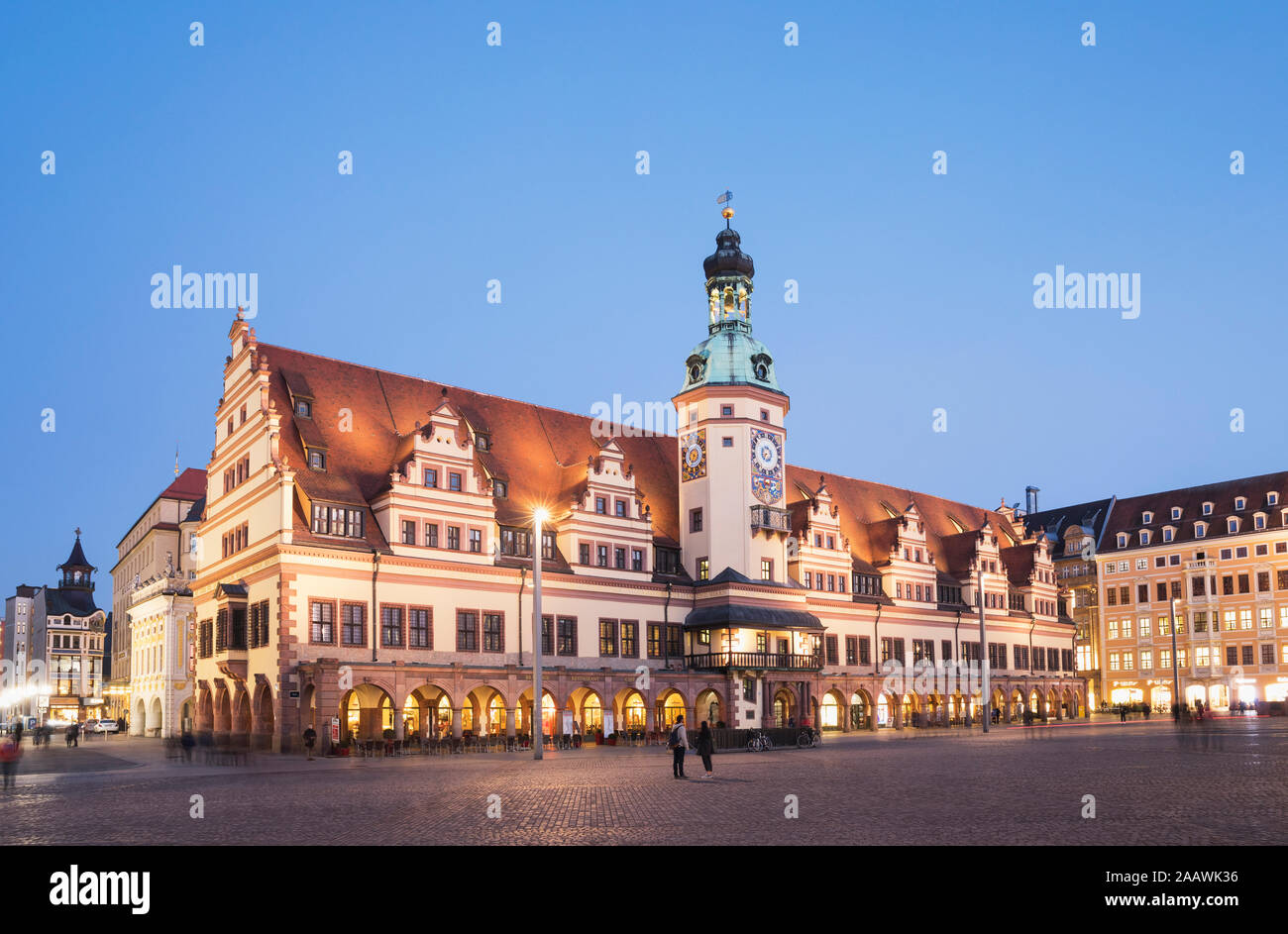 Low angle view of Town Hall Tower against clear blue sky in Leipzig at dusk, Germany Stock Photo