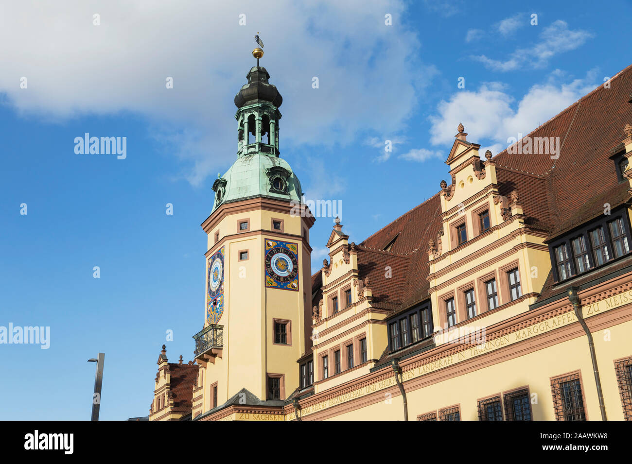 Low angle view of Town Hall Tower against blue sky in Leipzig during sunny day, Saxony, Germany Stock Photo