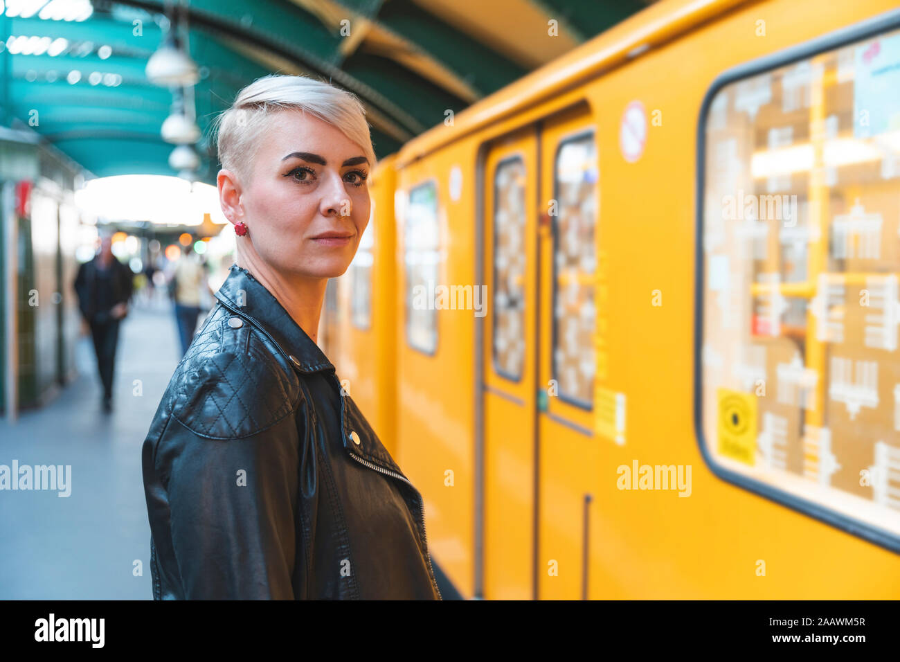 Portrait of woman standing at platform, Berlin, Germany Stock Photo - Alamy
