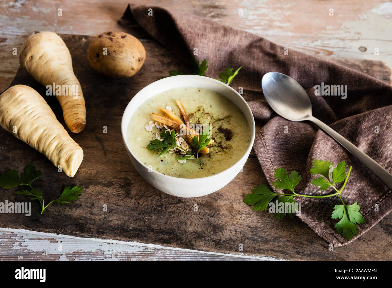 High angle view of oats soup served with ingredients on wooden table Stock Photo