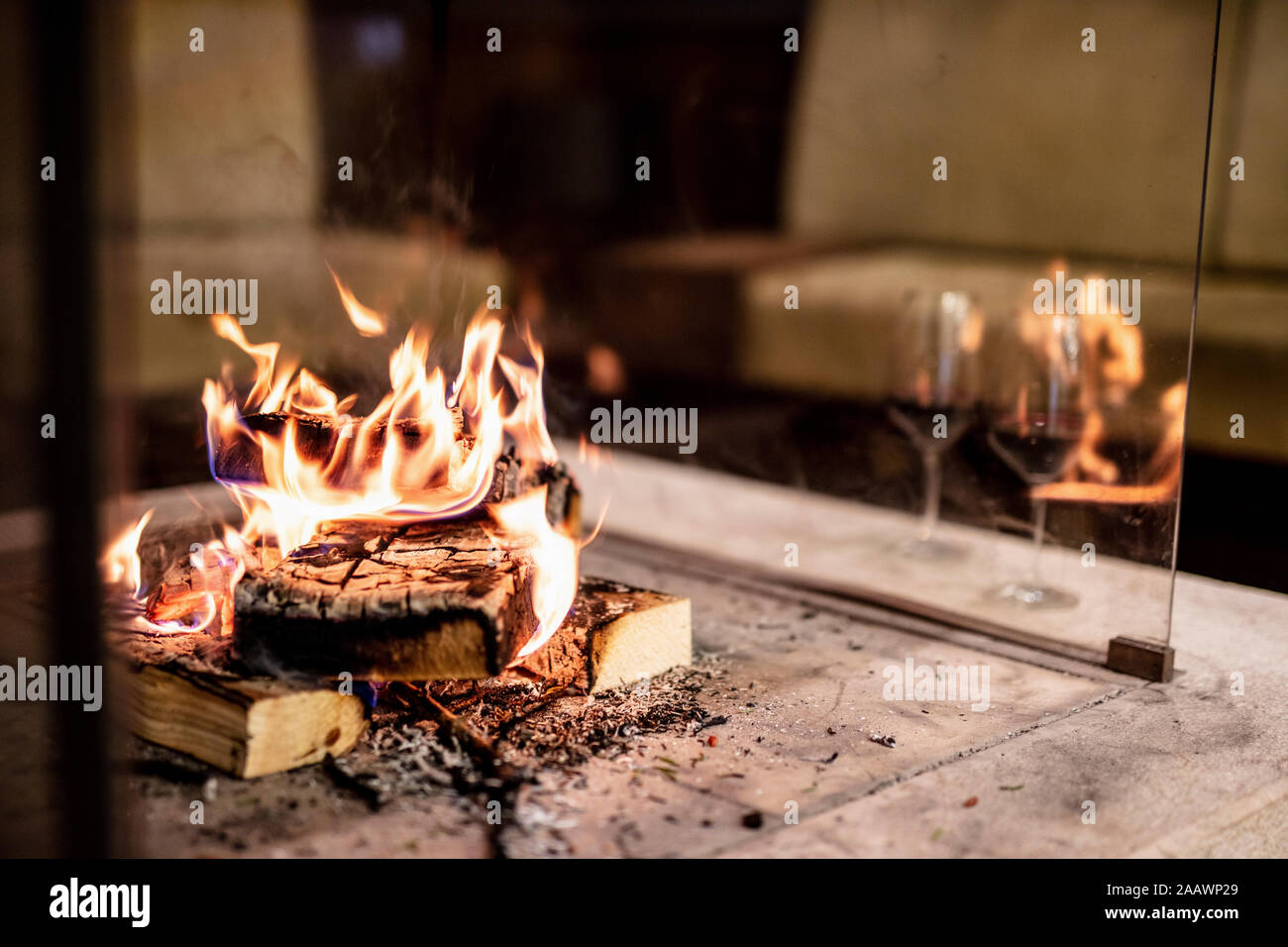 Close-up of wood burning at fireplace in house Stock Photo - Alamy
