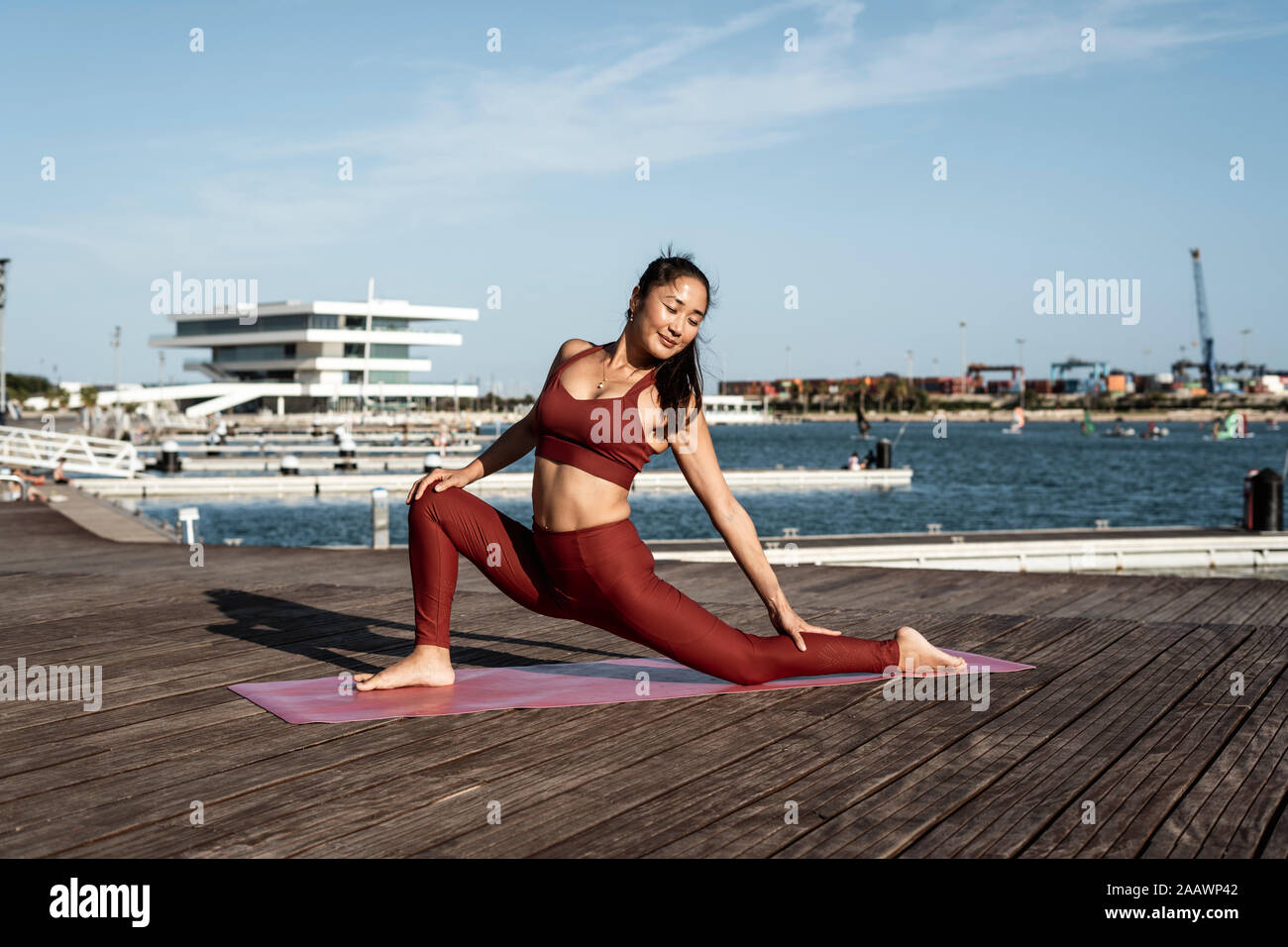 Asian woman practicing yoga Stock Photo