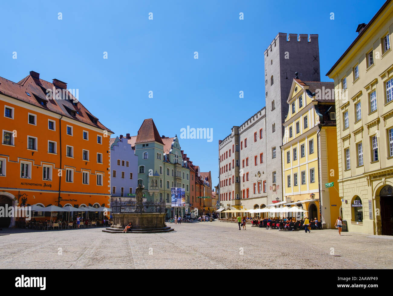 Buildings with Justitia fountain against clear blue sky at Haidplatz, Regensburg, Upper Palatinate, Bavaria, Germany Stock Photo