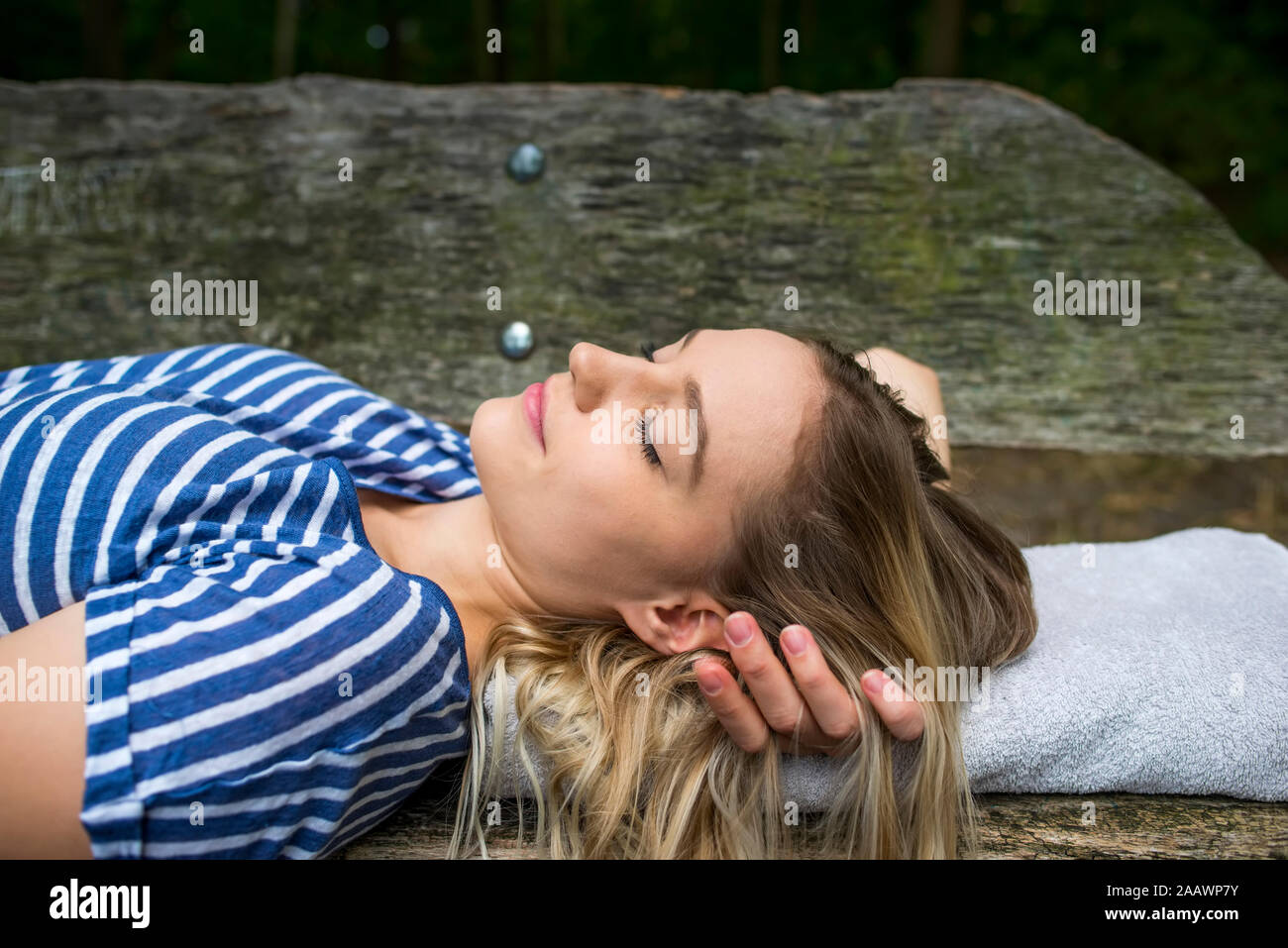 Woman sleeping on bench hi-res stock photography and images - Alamy