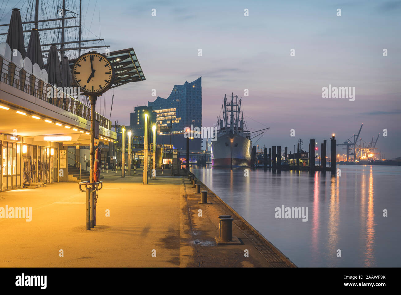 Clock on St. Pauli Piers against sky at sunrise, Hamburg, Germany Stock Photo