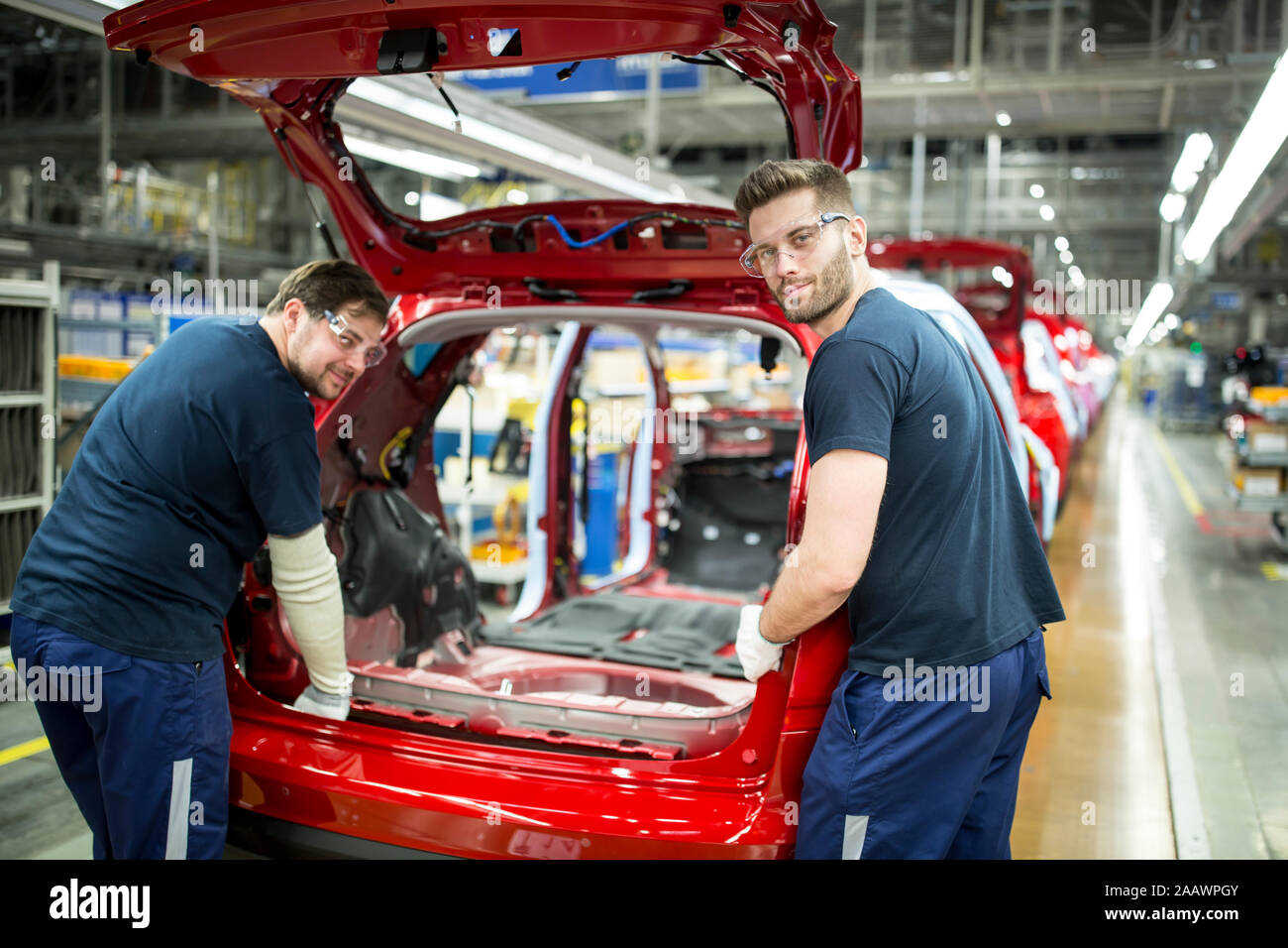 Two Colleagues Working In Modern Car Factory Stock Photo Alamy